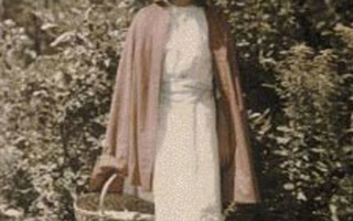 Woman in a white dress and red cloak holding a basket.