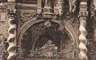 Brown-tinted print of a church's porch. There is a white pillar on each side of the porch.