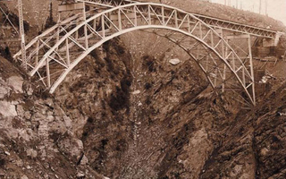 View of a bridge over a rocky canyon.
