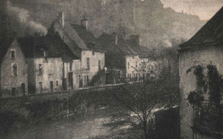 Row of houses above water.