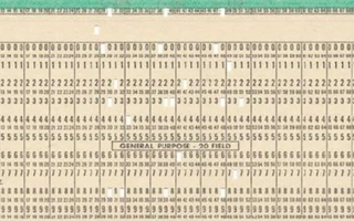 Tan paper card with holes and printed numbers.