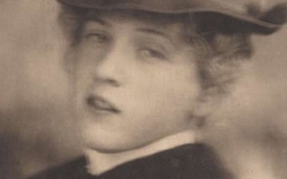 Blurred view of a woman wearing a hat.