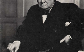 Portrait of Winston Churchill sitting in a suit.