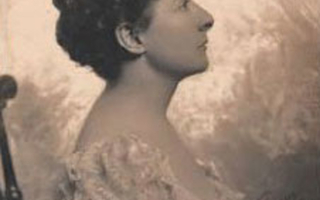 Side view of a woman looking up.