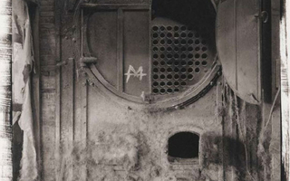 Metal boiler with one door open.