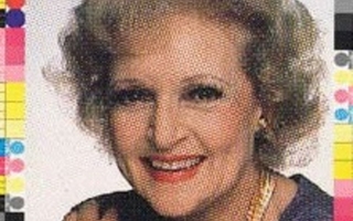 A woman with short hair smiling.