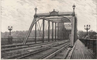 View of a bridge and train tracks.