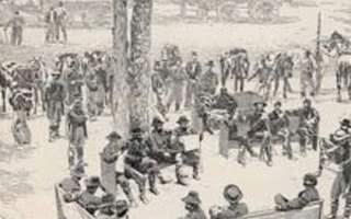 A group of soldiers sitting on benches.